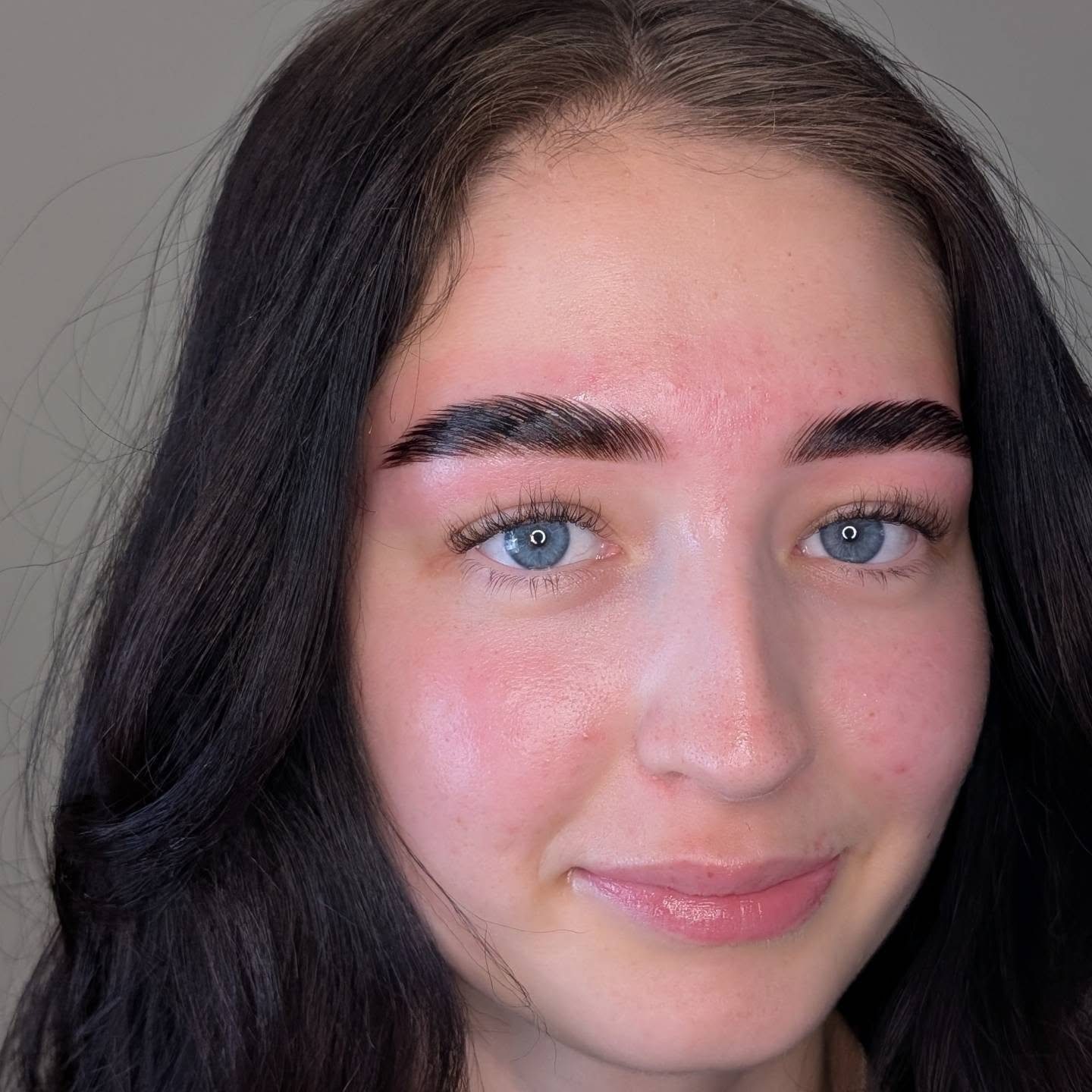 A client face-on with strong, finished brows